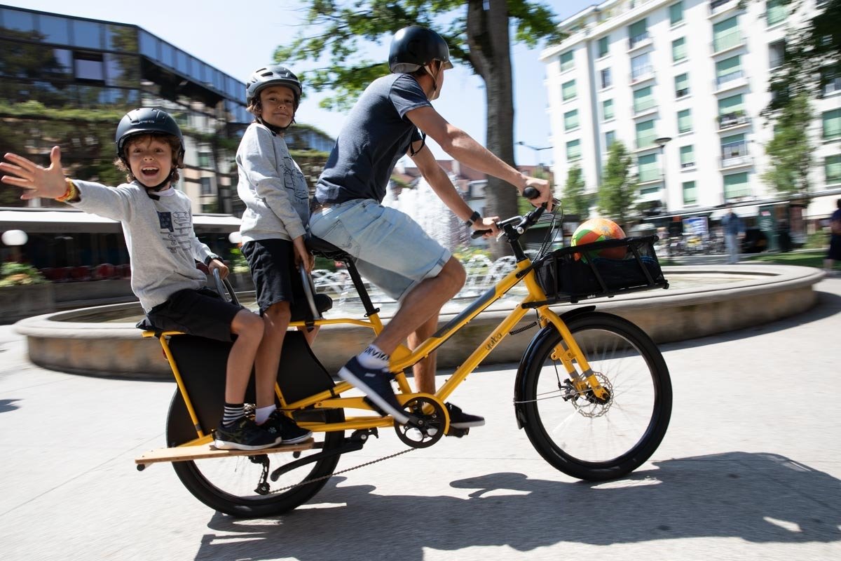 Family on a yellow electric cargo bike in Brisbane